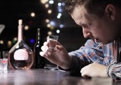 man abusing alcohol and drugs during holidays