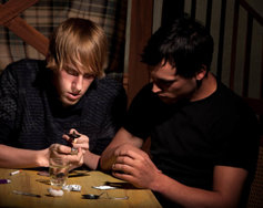two young men using heroin