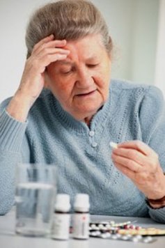 elderly woman taking prescription drugs