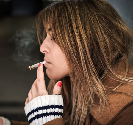 Girl smoking marijuana.