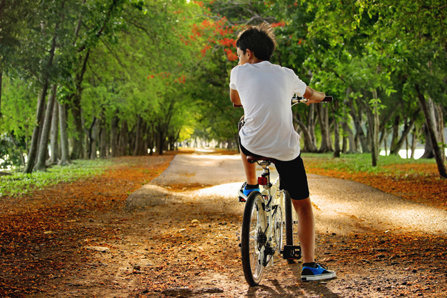 Boy on bicycle in the park