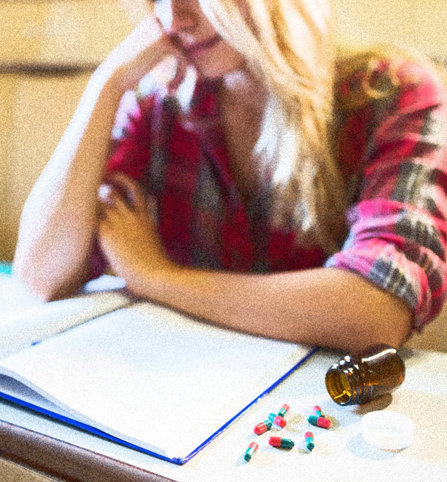 A college student gets through her days with pills.