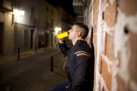 young man drinking an energy drink