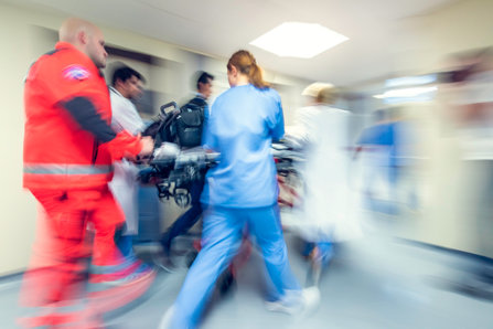 Paramedics running in a hospital