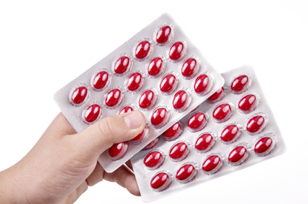Red cough medicine pills, like those containing dextromethorphan.