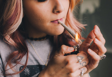 Girls smokes marijuana