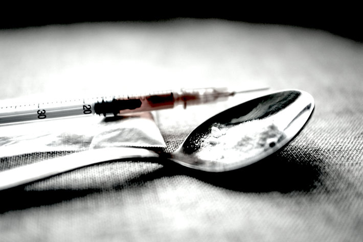 Heroin powder in spoon.