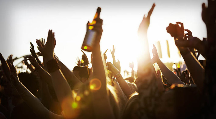 crowd drinking alcohol at a rock concert
