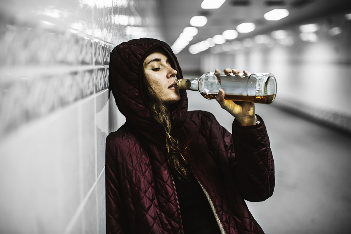 Woman drinking in the tunnel