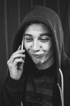 Guy liying on the phone