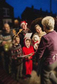 A family goes caroling at a neighbor’s house.