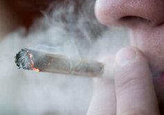 teen smoking a marijuana joint
