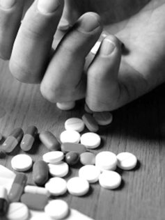 hand with prescription pills