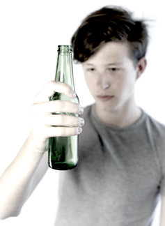 Teenager boy holding alcohol.
