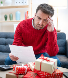 Sad man with a money problem during Christmas 