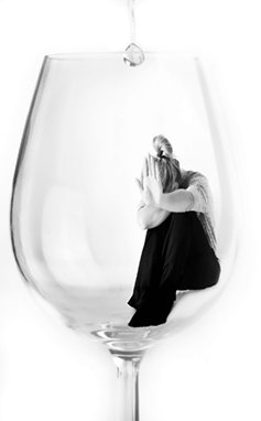 Woman sitting inside a glass
