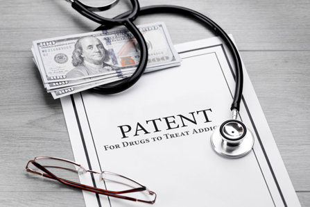 Medical patent document and money.
