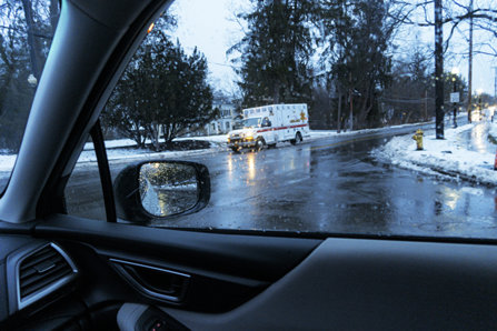 Ambulance in a rainy road