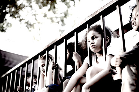 Sad kids sitting on balcony.