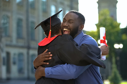 College success, son hugs dad