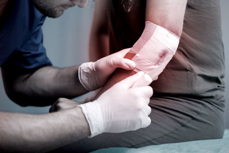 Xylazine ulcers, doctor putting bandage