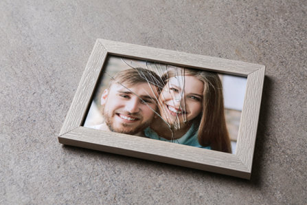 Crashed picture frame of a couple.