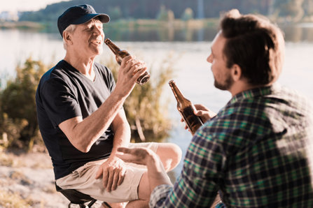 Father drinks beer with his son – enabling 