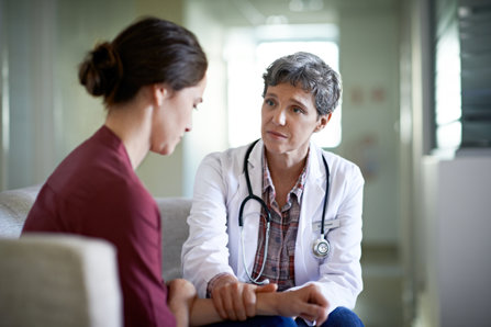 Doctor talks with patient