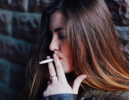 teen smoking a cigarette