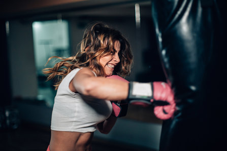 Angry woman boxing hard