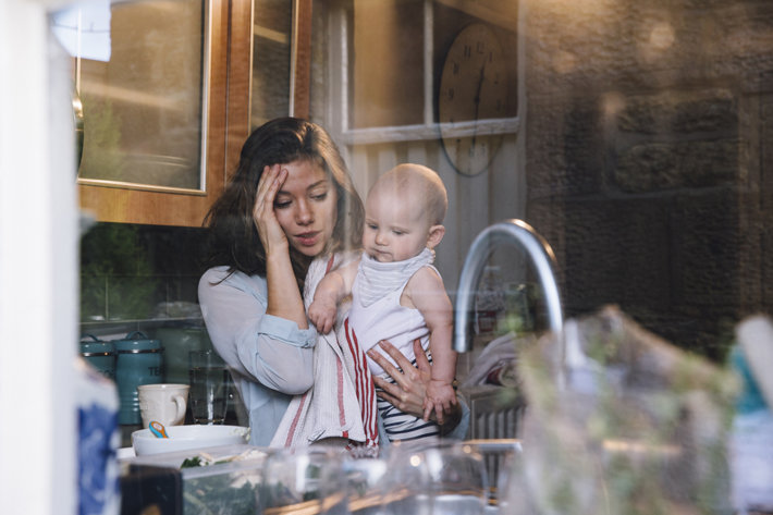 Young mother in the kitchen