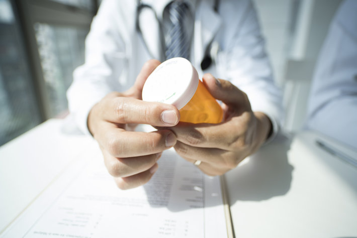Doctors holds prescription bottle