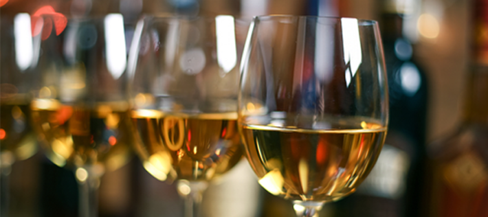 Glasses of white wine could be contributing to increases in melanoma cases.
