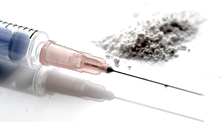 Syringe with powder closeup.